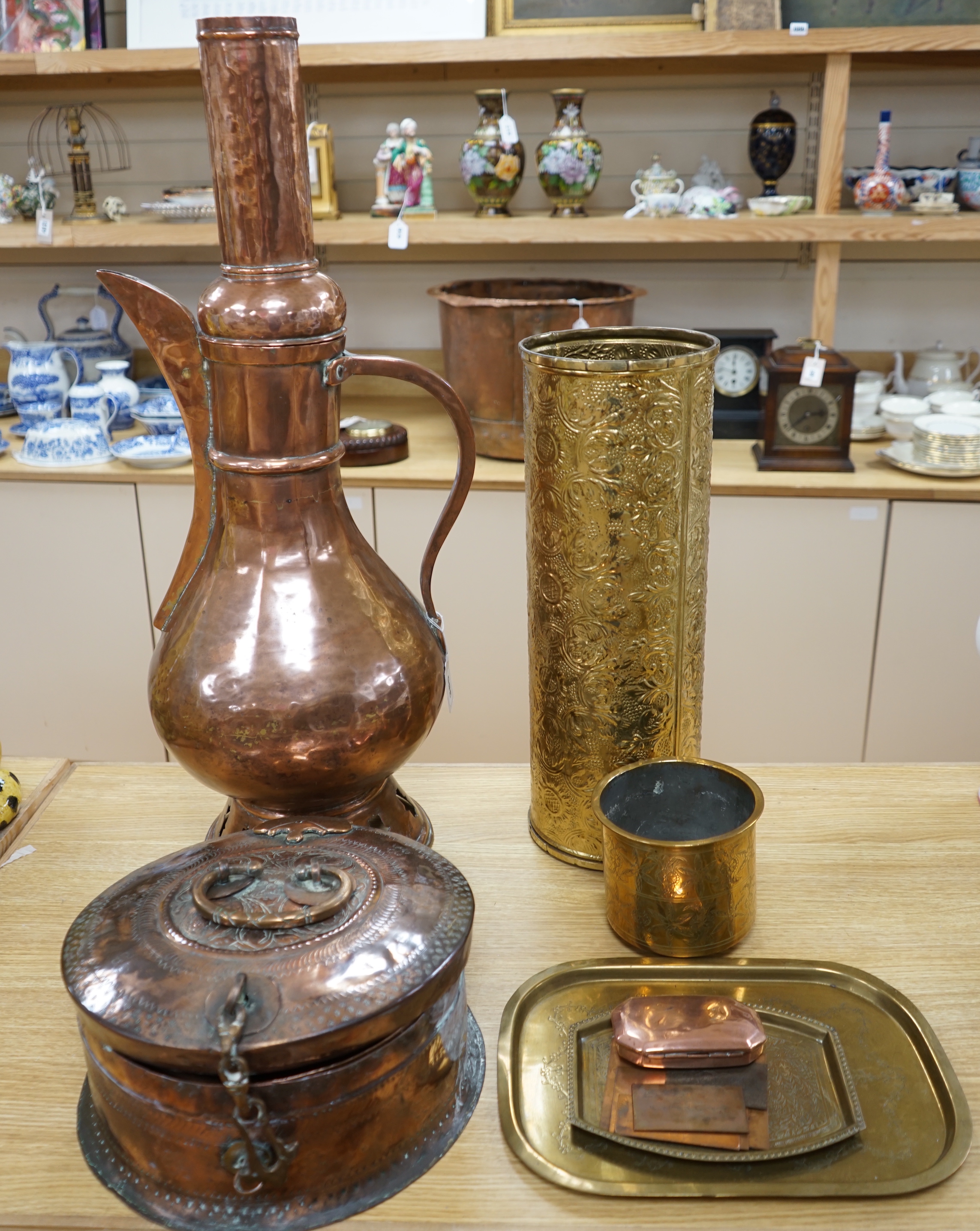 A group of Pakistani metalware including a paan box, the cover 31cm diameter